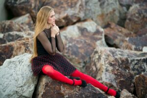 girl wearing red knee high socks with tights