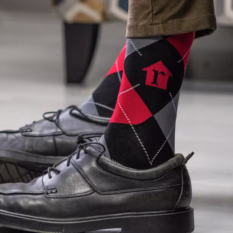 Custom-designed socks featuring a argyle diamond patterns and color combinations.