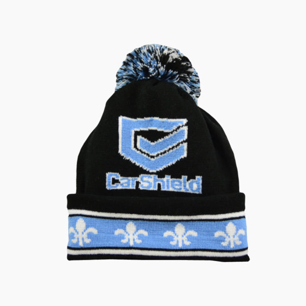 a black and blue knit hat with a pom