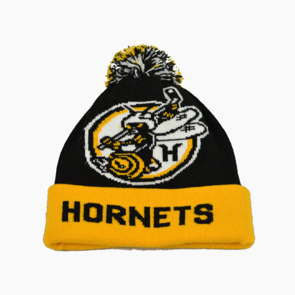 a black and yellow knit hat with a yellow and black logo