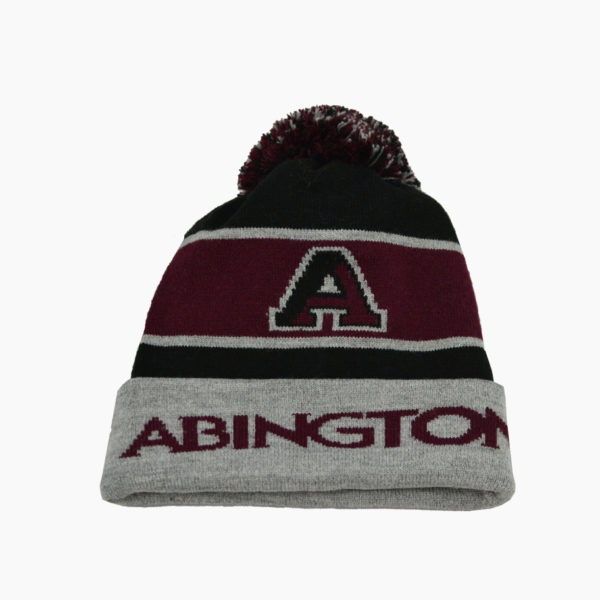 a knit hat with a pom