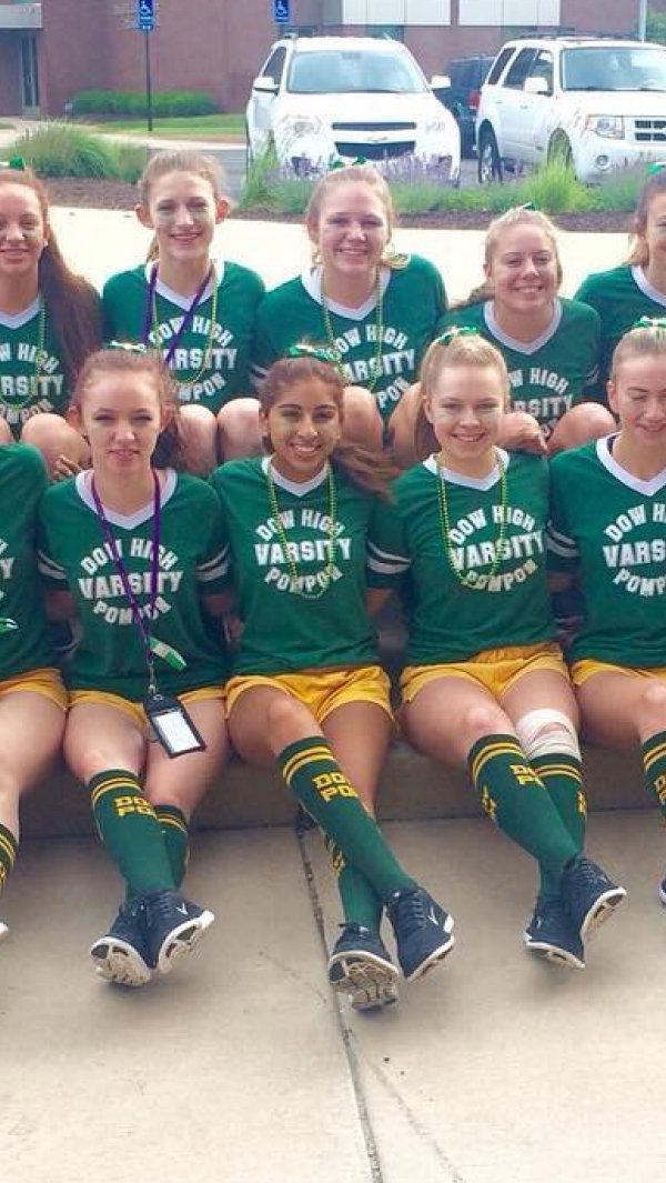 team sitting showing off custom athletic socks