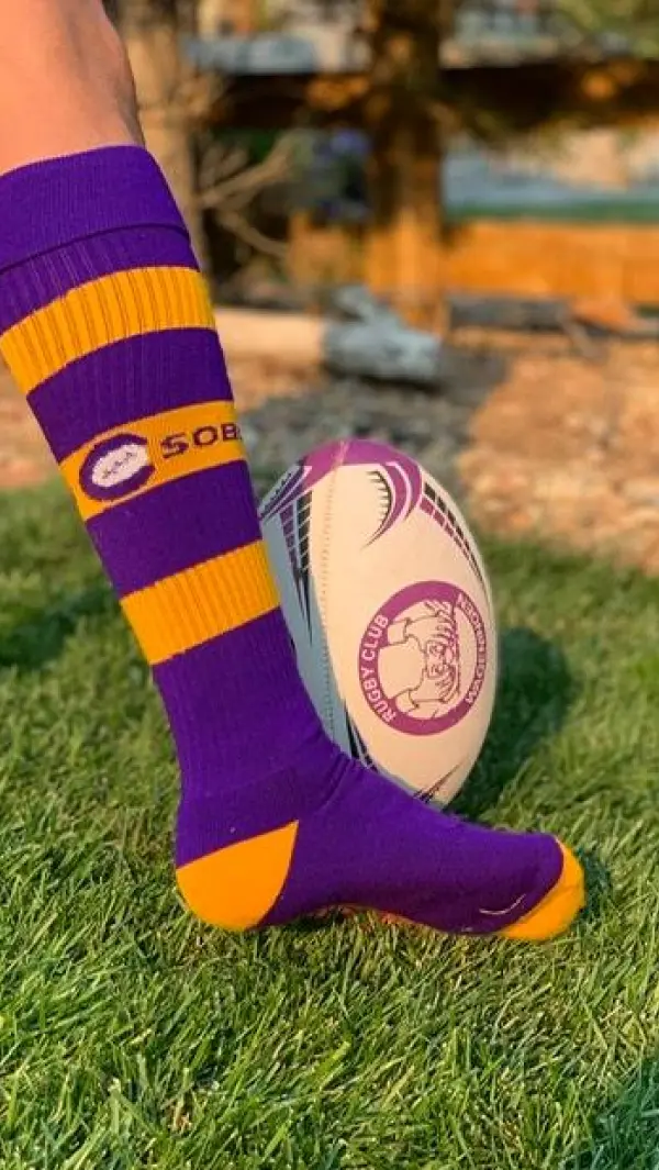 custom football sock kicking football