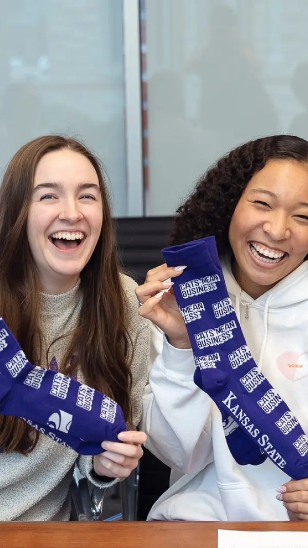 students holding custom college socks