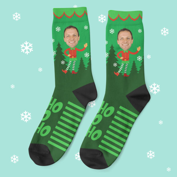 a pair of green socks with a man's face on them