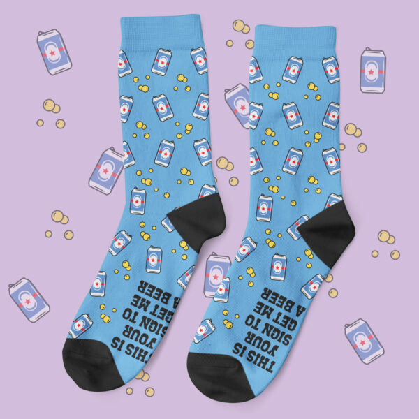 a pair of blue socks with beer cans on them