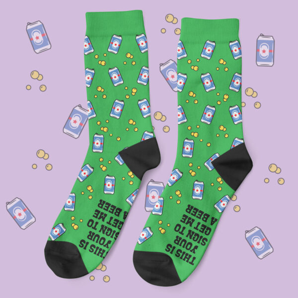 a pair of green socks with images on them