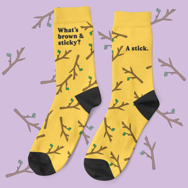 a pair of yellow socks with black text