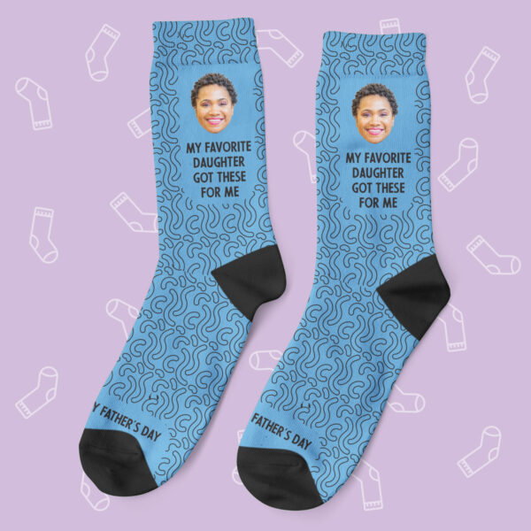 a pair of blue socks with a picture of a woman's face