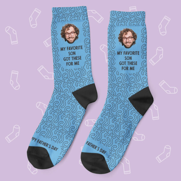 a pair of blue socks with a picture of a man on them