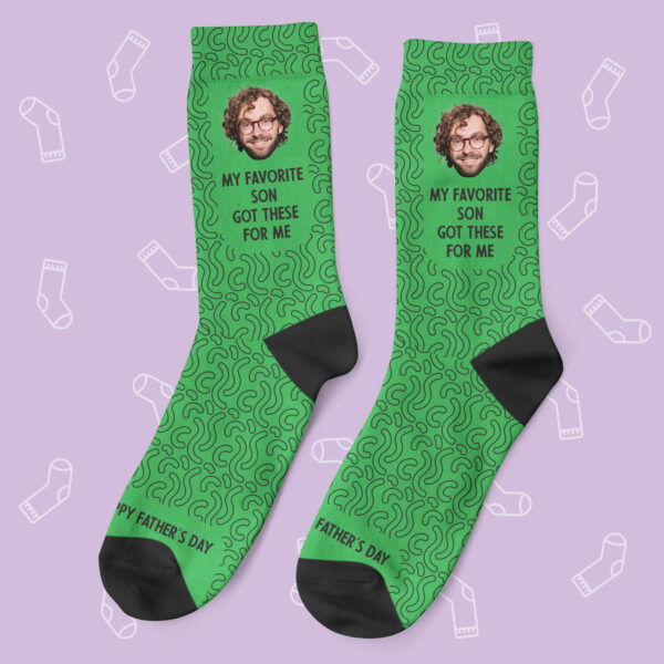 a pair of green socks with images on them
