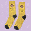 a pair of yellow socks with images on them