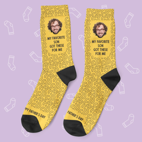 a pair of yellow socks with images on them