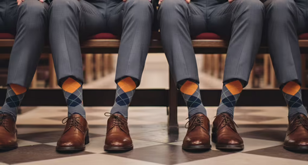 A wedding party, showcasing their custom-designed argyle pattern socks.